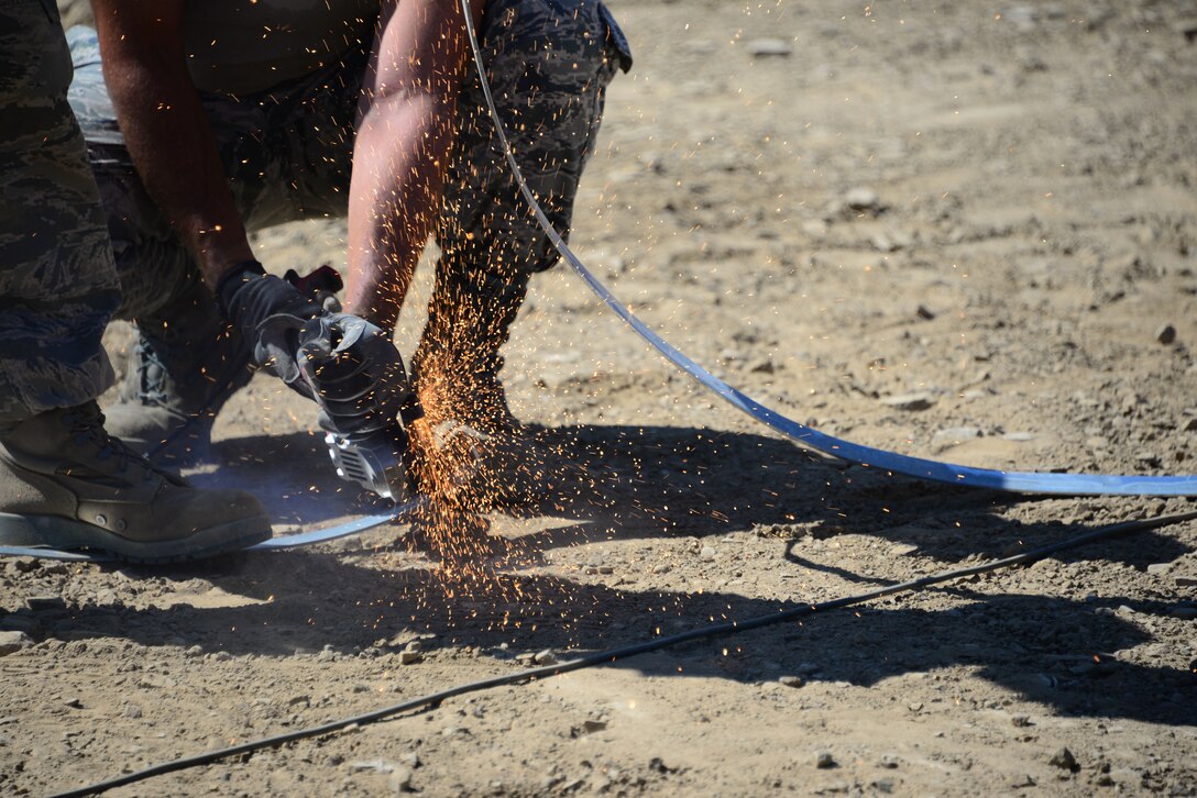 Airmen from the 118th Mission Support Group, Tennessee Air National Guard, construct lightening protection grid work for the Ammo Holding Area, better known as the AHA, Aug. 16, 2016, at Novo Selo Training Area, Bulgaria.  Tennessee National Guard Soldiers and Airmen were on rotations to complete thier portions of projects as part of Operation Resolute Castle 16, an ongoing operation of military construction to build up Eastern European base infrastructure and help strengthen ties between Tennessee's state partnership with Bulgaria. (U.S. Air National Guard photo by Master Sgt. Kendra M. Owenby, 134 ARW Public Affairs)