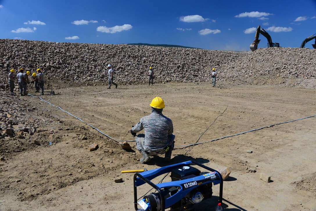 Airmen from the 118th Mission Support Group, Tennessee Air National Guard, construct lightening protection grid work for the Ammo Holding Area, better known as the AHA, Aug. 16, 2016, at Novo Selo Training Area, Bulgaria.  Tennessee National Guard Soldiers and Airmen were on rotations to complete thier portions of projects as part of Operation Resolute Castle 16, an ongoing operation of military construction to build up Eastern European base infrastructure and help strengthen ties between Tennessee's state partnership with Bulgaria. (U.S. Air National Guard photo by Master Sgt. Kendra M. Owenby, 134 ARW Public Affairs)