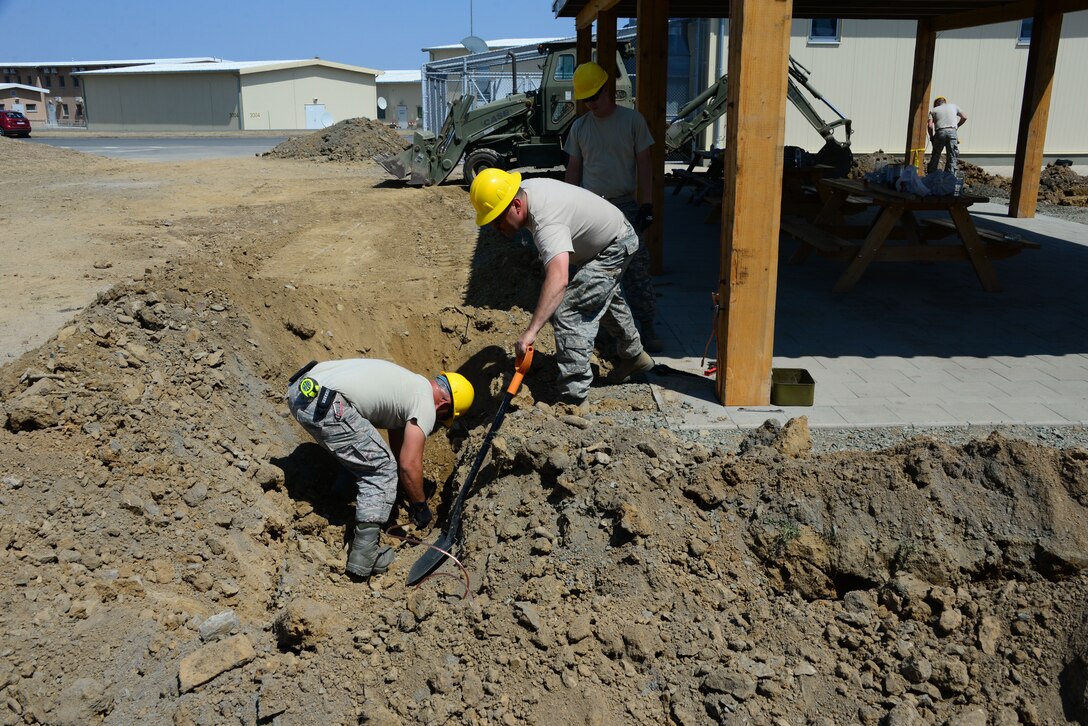 Airmen from the 118th Civil Engineer Squadron, Tennessee Air National Guard, install lightening protection at a pavilion Aug. 10, 2016, at Novo Selo Training Area, Bulgaria.  Tennessee National Guard Soldiers and Airmen were on rotations to complete thier portions of projects as part of Operation Resolute Castle 16, an ongoing operation of military construction to build up Eastern European base infrastructure and help strengthen ties between Tennessee's state partnership with Bulgaria. (U.S. Air National Guard photo by Master Sgt. Kendra M. Owenby, 134 ARW Public Affairs)