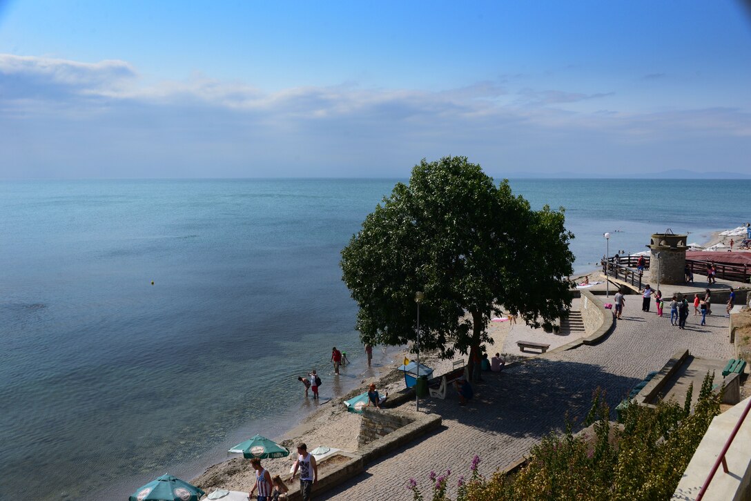 Visitors walk the beach at Nessebar, Bulgaria.  Airmen and Soldiers from the Tennessee National Guard toured the resort town on the Black Sea as part of a Morale Wellness and Recreation event Aug. 12., 2016 while deployed to Novo Selo Training Area, Bulgaria.  Tennessee National Guard Soldiers and Airmen were on rotations as part of Operation Resolute Castle 16, an ongoing operation of military construction to build up Eastern European base infrastructure and help strengthen ties between Tennessee's state partnership with Bulgaria.  (U.S. Air National Guard photo by Master Sgt. Kendra M. Owenby, 134 ARW Public Affairs)