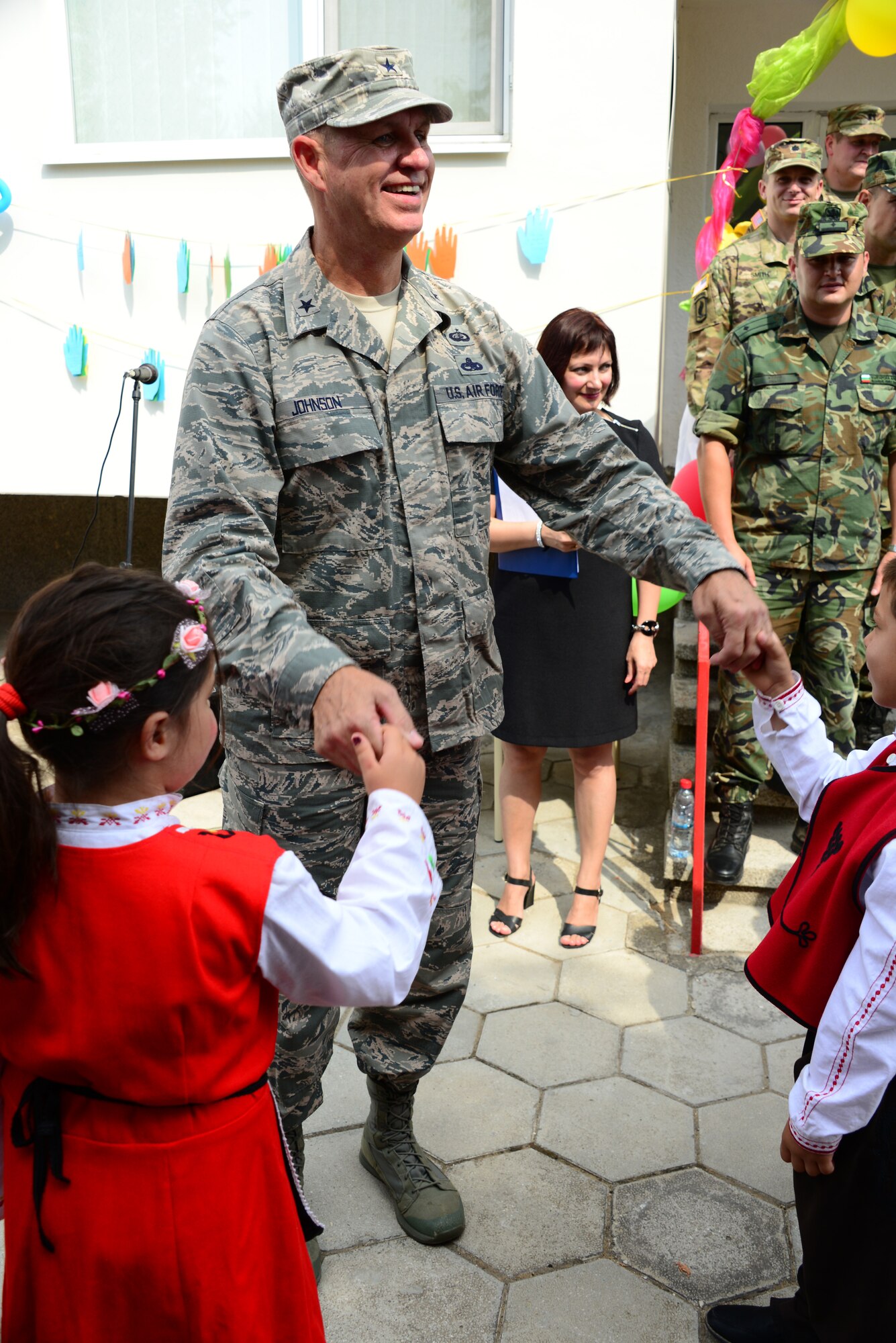 Brig. Gen. Donald Johnson, Assistant Adjutant Gen. (Air), Tennessee, dance with Bulgarian students at the grand re-opening of the Izvorche Kindergarten school in Kabile, Bulgaria, Aug. 24, 2016.  Tennessee National Guard Soldiers and Airmen from the 164th Civil Engineer Squadron, 118th Mission Support Group, 134th Air Refueling Wing, and the 194th Engineer Brigade deployed to nearby Novo Selo Training Area for thier annual training to participate in Humanitarian Civic Assistance projects such as the renovation of the school.  The projects build skills for the Airmen while helping to strengthen ties with Tennessee and Bulgaria through the State Partnership Program.  (U.S. Air National Guard photo by Master Sgt. Kendra M. Owenby, 134 ARW Public Affairs)