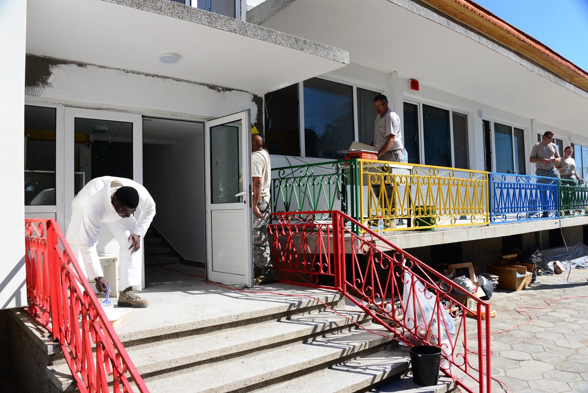 Airmen from the 164th Civil Engineer Squadron, Tennessee Air National Guard, repaint playground equipment at a Bulgarian elementary school Aug. 15, 2016, prior to the new school year.  Tennessee National Guard Soldiers and Airmen deployed to Novo Selo Training Area, Bulgaria to participate in Humanitarian Civic Assistance projects.  The projects help strengthen ties with Tennessee and Bulgaria through the State Partnership Program, while providing skills and labor to those in need.  (U.S. Air National Guard photo by Master Sgt. Kendra M. Owenby, 134 ARW Public Affairs)