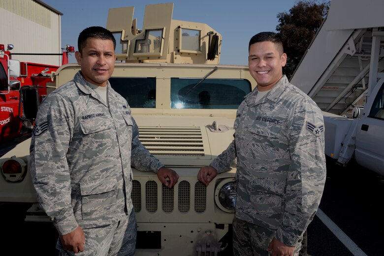 Staff Sgt. Angel Ramirez Arenas (Left), 60th Logistical Readiness Squadron NCO in charge of fleet management, poses for a photo with his brother, Senior Airman Ramon Ramirez Arenas (Right), 60th Surgical Operations Squadron surgical technician, at Travis Air Force Base, Calif., Sept. 7, 2016. The brothers from Compton, Calif., have been assigned to TAFB for almost two years and have nearly a decade of military service between them. (U.S. Air Force photo by Tech. Sgt. James Hodgman)