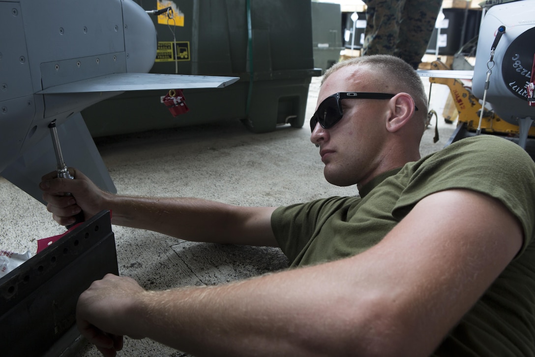 U.S. Aviation Ordnance Marines with Marine Aviation Logistics Squadron12 prepare ordnance for aviation squadrons participating in Valiant Shield 16 at Andersen Air Force Base, Guam, September 12, 2016. The ordnance constructed, provided the Marines of MALS-12 valuable experience assembling live ordnance to be used  during VS16 for a ship sinking exercise. VS16 is a biennial U.S. only, field training exercise that focuses on joint training with U.S. Navy, Air Force and Marine Corps to increase interoperability and working relationships. (U.S. Marine Corps photo by Sgt. Justin A. Fisher)