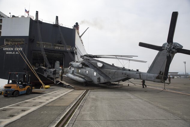 U.S. Marines with Marine Heavy Helicopter Squadron (HMH) 361, unload a CH-53E Super Stallion from the Green Cove, a vehicle carrier, at Marine Corps Air Station Iwakuni, Japan, Sept. 16, 2016. The Green Cove, a vehicle carrier, transported six aircraft approximately 6,000 miles from Naval Air Station North Island, San Diego, Calif. The aircraft are scheduled to fly to their units after concluding preparations at MCAS Iwakuni. (U.S. Marine Corps photo by Lance Cpl. Aaron Henson)