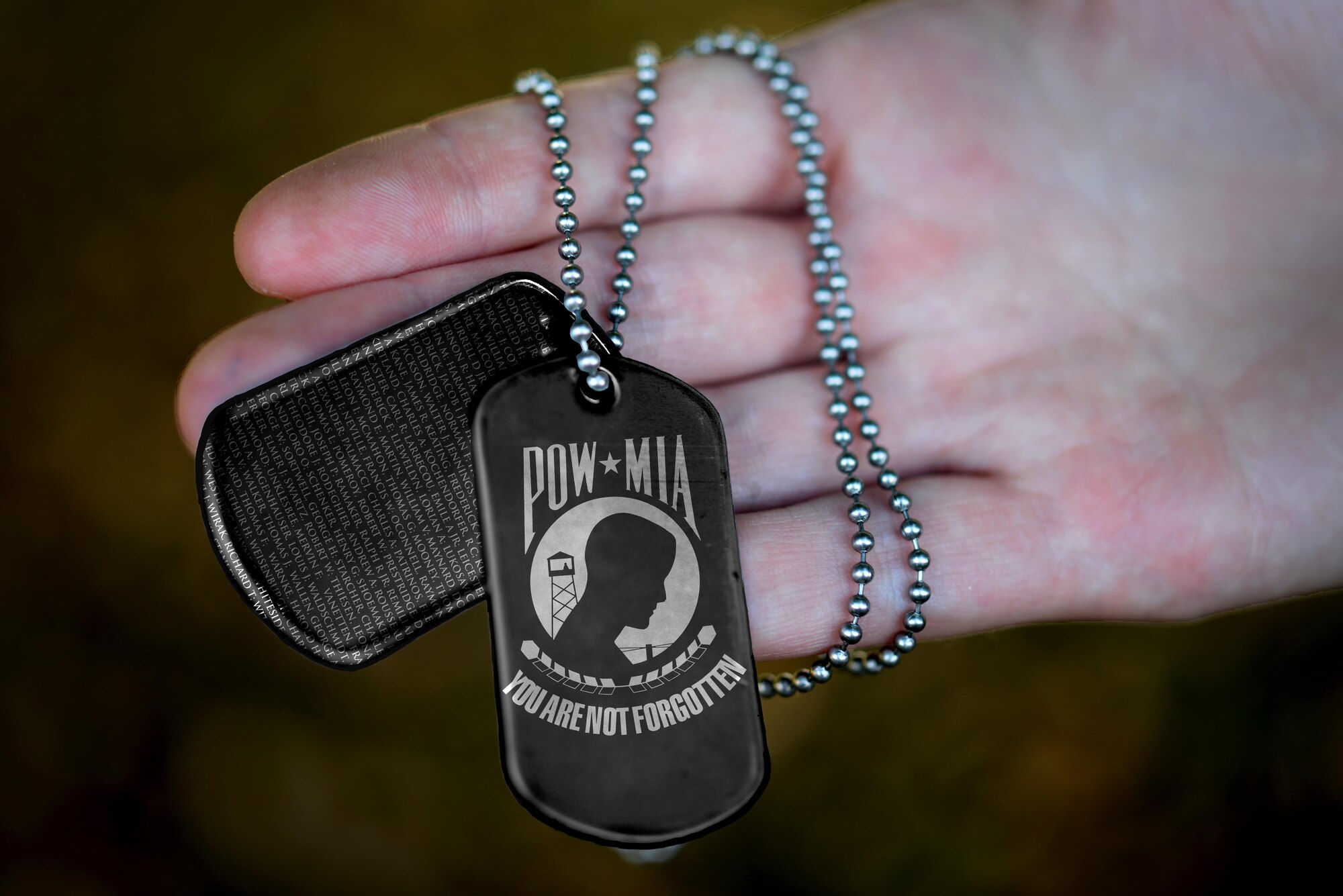 Liberty Wing Airmen observe National POW/MIA Recognition Day at Royal Air Force Lakenheath, England, Sept. 16, 2016. According to the Defense POW/MIA Accounting Agency, more than 83,000 Americans are unaccounted for from past conflicts. (U.S. Air Force photo illustration/Airman 1st Class Eli Chevalier) 