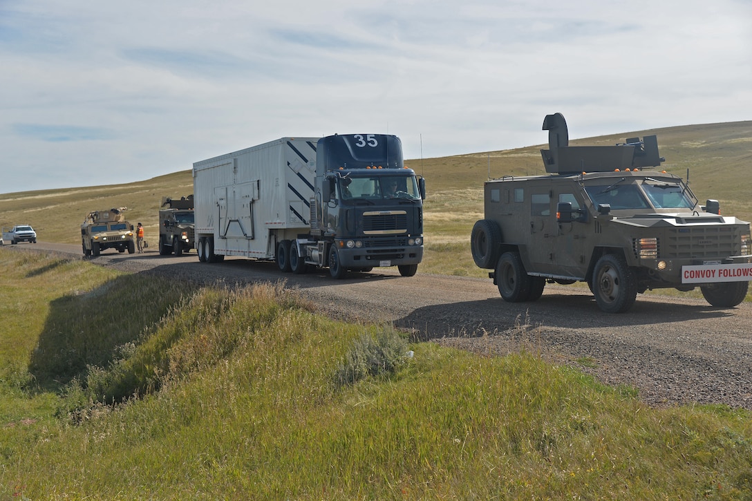 Members of the 741st Missile Security Forces Squadron Convoy Response Force stage a scenario as part of a Local Integrated Response Plan exercise Sept. 14, 2016, near Stanford, Mont.  The LIRP is a generalized plan that coordinates the response capabilities of the Air Force, FBI and civilian law enforcement departments within the state if a nuclear asset were ever threatened or compromised.  (U.S. Air Force photo/Airman First Class Daniel Brosam)
