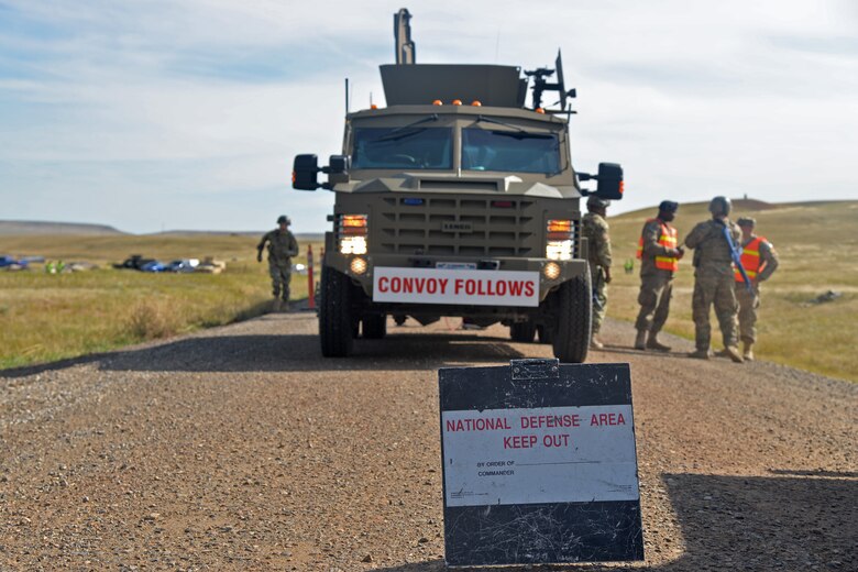 Members from the 741st Missile Security Forces Squadron Convoy Response Force stage a National Defense Area as part of a Local Integrated Response Plan exercise Sept. 14, 2016, near Stanford, Mont.  The LIRP is a generalized plan that coordinates the response capabilities of the Air Force, FBI and civilian law enforcement departments within the state if a nuclear asset were ever threatened or compromised.  (U.S. Air Force photo/Airman First Class Daniel Brosam)