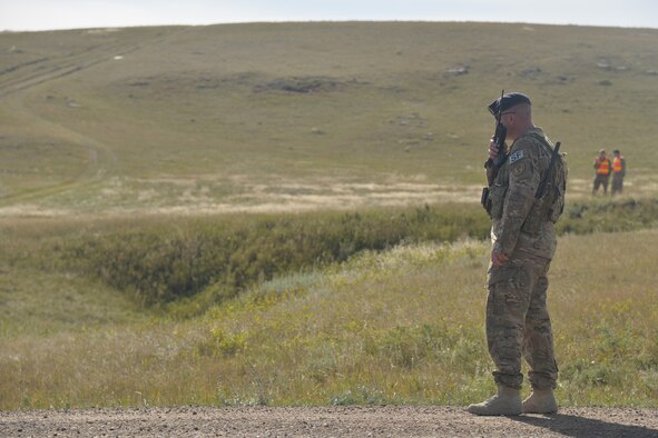 Master Sgt. Jason Shores, 741st Missile Security Forces Squadron Convoy Response Force section chief, communicates with team members during a Local Integrated Response Plan exercise Sept. 14, 2016, near Stanford, Mont.  The LIRP is a generalized plan that coordinates the response capabilities of the Air Force, FBI and civilian law enforcement departments within the state if a nuclear asset were ever threatened or compromised.  (U.S. Air Force photo/Airman First Class Daniel Brosam)

