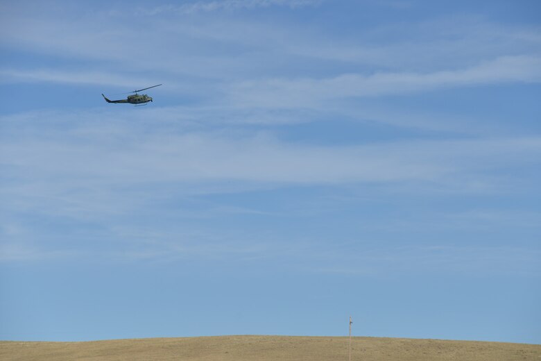 The 40th Helicopter Squadron along with Airmen from the 741st Missile Security Forces Squadron Tactical Response Force provide overhead security for Airmen on the ground as part of a Local Integrated Response Plan exercise, Sept. 14, 2016, near Monarch, Mont.  The LIRP is a generalized plan that coordinates the response capabilities of the Air Force, FBI and civilian law enforcement departments within the state if a nuclear asset were ever threatened or compromised.  (U.S. Air Force photo/Airman First Class Daniel Brosam)