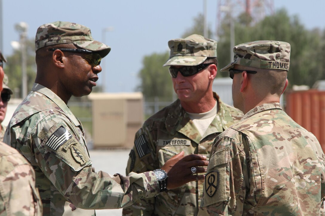 Command Sgt. Major William F. Thetford (middle), command senior enlisted leader of the U.S. Central Command, Command Sgt. Maj. Edward A. Bell (left), command senior enlisted advisor with the 1st Theater Sustainment Command, and Command Sgt. Maj. Dennis J. Thomas (right), command senior enlisted leader with the 451st Expeditionary Sustainment Command, greet prior to meeting Soldiers of the 338th Transportation Detachment at the Kuwait Naval Base, Sept. 14, 2016.

Thetford visited the Soldiers to get direct insight into their concerns, accomplishments, and current sustainment operations.