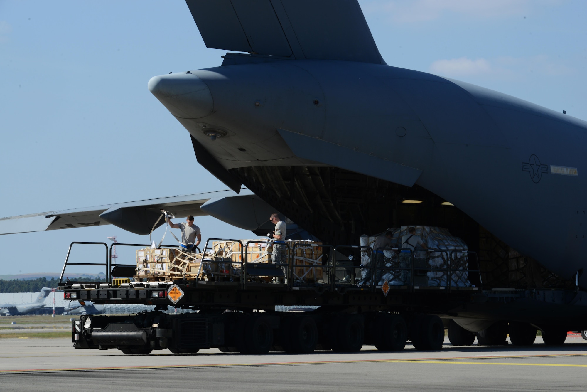Airmen from the 721st Aerial Port Squadron load a C-17 Globemaster III Sept. 7, 2016, at Ramstein Air Base, Germany. The 721st APS broke a record, July 27, loading 120 tons of cargo onto a Boeing 747, the highest allowable cargo load utilized on any commercial aircraft. (U.S. Air Force photo/ Airman 1st Class Joshua Magbanua) 