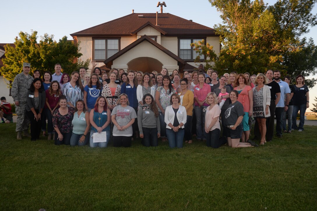 Spouses pose for a group photo during a quarterly Heart Link seminar at Ellsworth Air Force Base, S.D., Sept. 9, 2016. Heart Link is geared toward spouses who have been married to military members five years or less and teaches them basic Air Force structure and the 28th Bomb Wing mission. (U.S. Air Force photo by Airman 1st Class Denise M. Jenson)