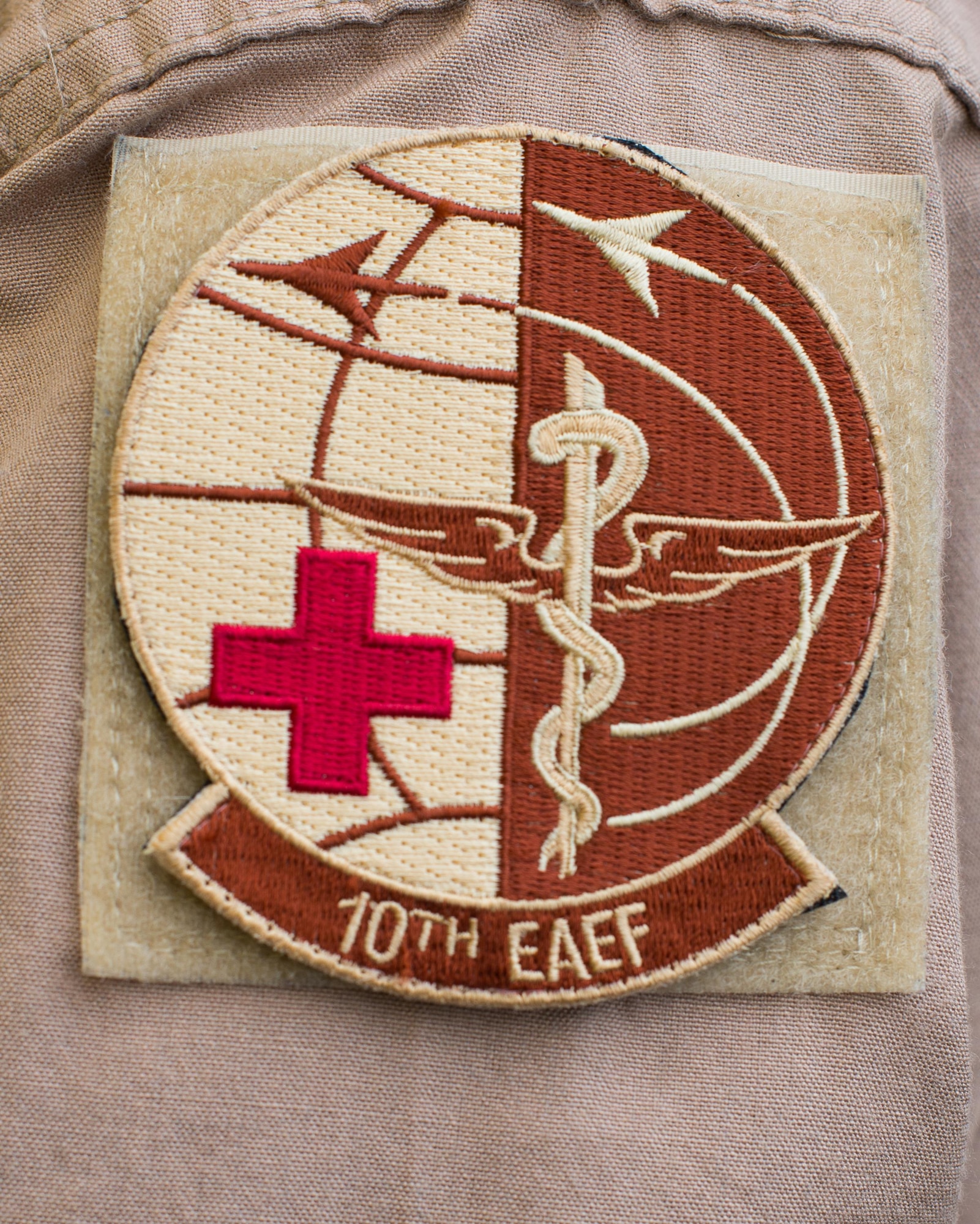 Senior Master Sgt. Theresa Sheheen, 10th Expeditionary Aeromedical Evacuation Flight superintendent, wears a flight patch at Ramstein Air Base, Germany, Sept. 9, 2016. Members of the 10th EAEF provide medical care to injured service members while transporting them to larger medical facilities. (U.S. Air Force photo/Senior Airman Jimmie D. Pike)