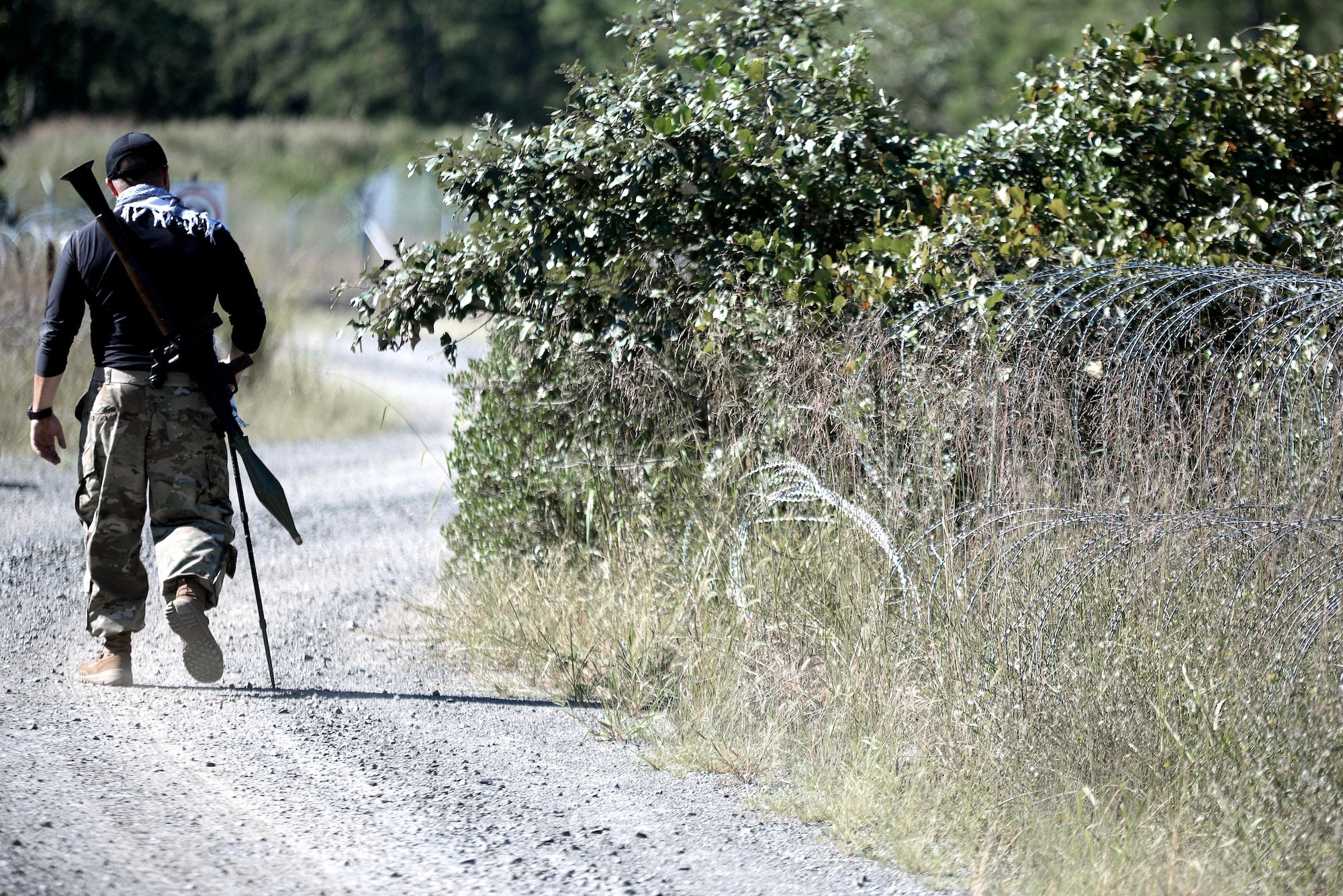 A mock insurgent leaves the scene with his rocket-propelled grenade after his role in the roadside attack scenario on Range Road at Joint Base McGuire-Dix-Lakehurst, N.J., on Sept. 13, 2016. Soldiers assigned to the 23rd Military Police Company, Ft. Drum, N.Y., conducted a culminating training event from Sept. 6 to Sept. 16 at JB MDL. 