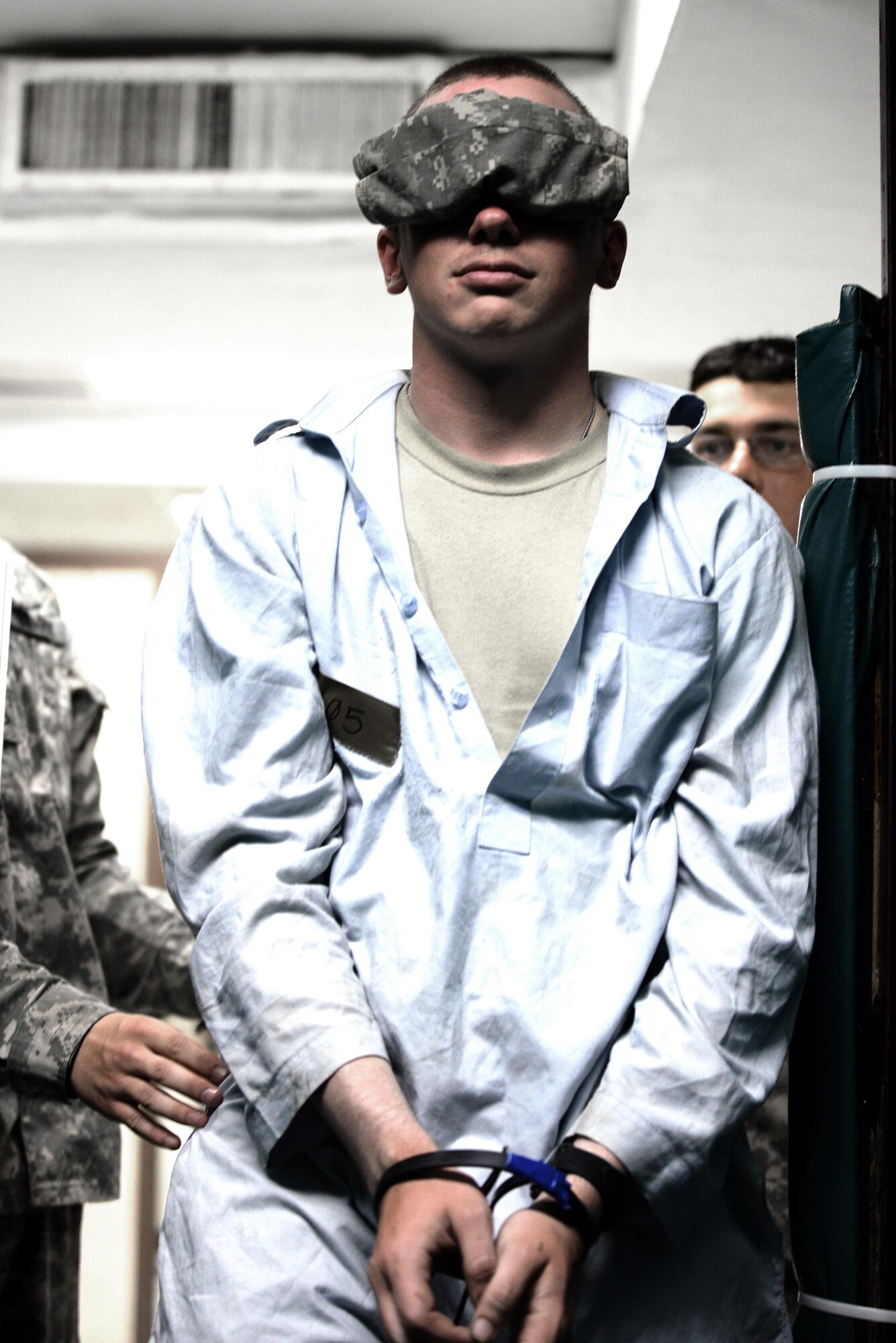 Pfc. David Doughty, 23rd Military Police Company, Ft. Drum, N.Y., plays the role of a mock detainee as he’s escorted to the holding area during a training exercise on Joint Base McGuire-Dix-Lakehurst, N.J., on Sept. 13, 2016. Soldiers from the 23rd Military Police Company convoyed to Joint Base McGuire-Dix-Lakehurst, N.J., to conduct combat training from Sept. 6 to Sept. 16.