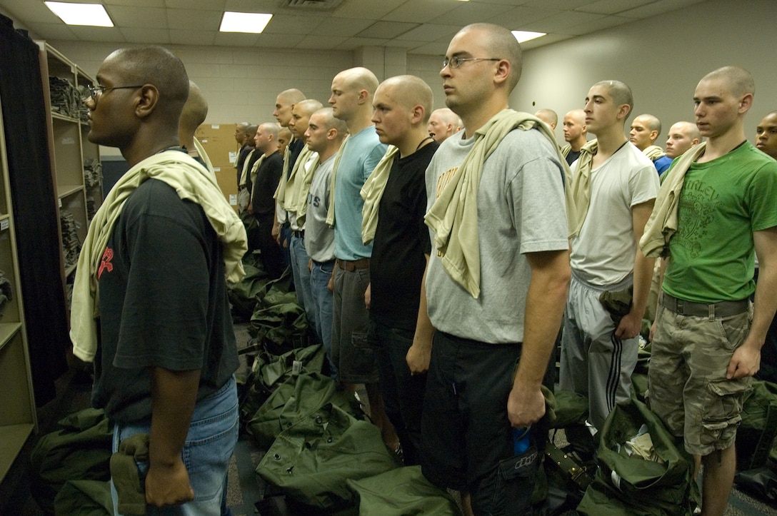 0 WOT Trainees receiving their initial issue of uniforms. (U.S. Air Force Photo Training Development Flight)