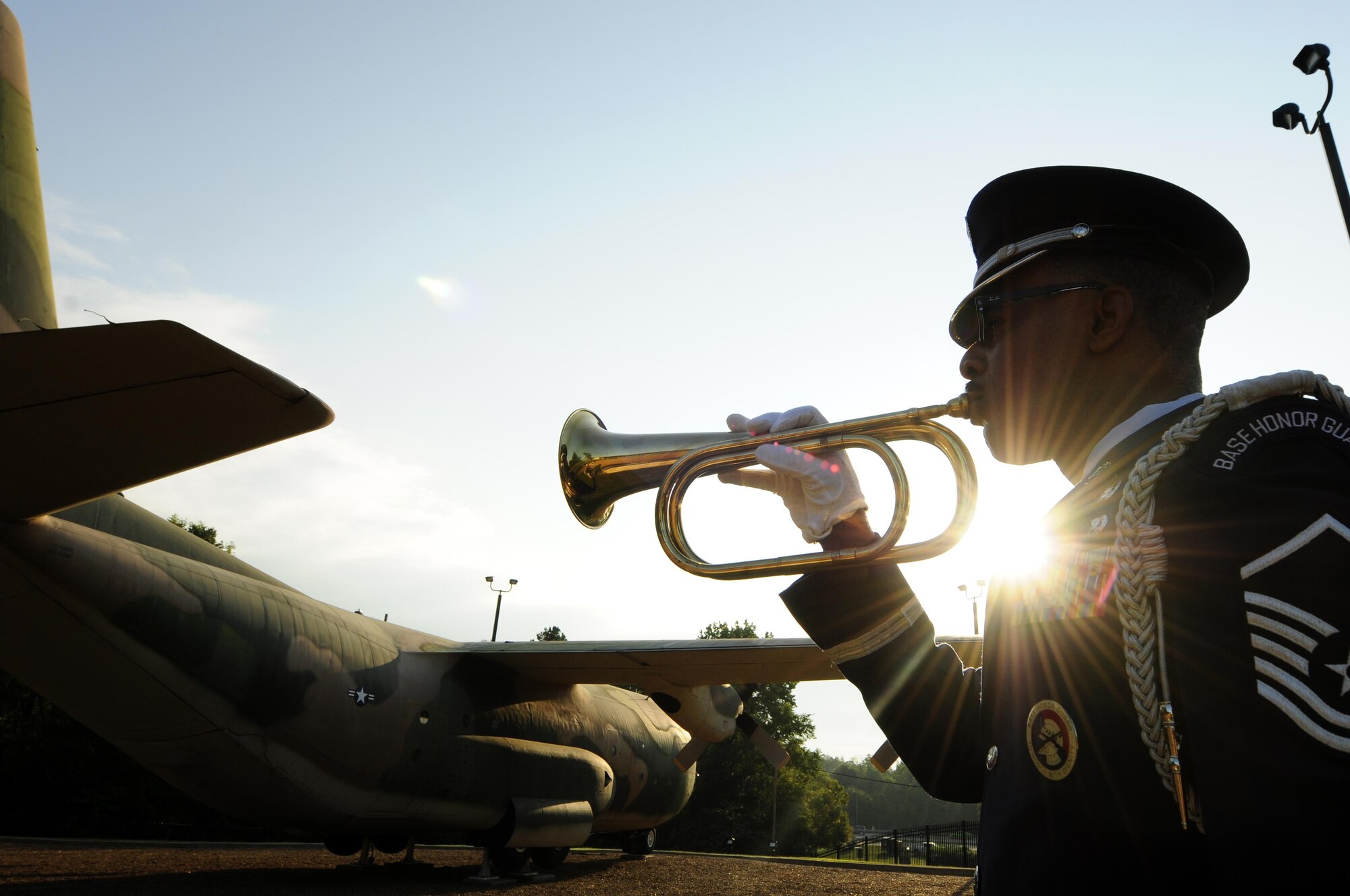 Master Sgt. Brian Adams, from the 145th Force Support Squadron, plays taps to honor the lives lost 15 years ago on Sept. 11, 2001, during a remembrance ceremony at the North Carolina Air National Guard Base, N.C., Sept. 11, 2016. The song is a bugle call traditionally played at dusk, ceremonies, and military funerals; during this ceremony taps was played to honor the lives that were lost. (U.S. Air National Guard photo/Staff Sgt. Julianne M. Showalter)