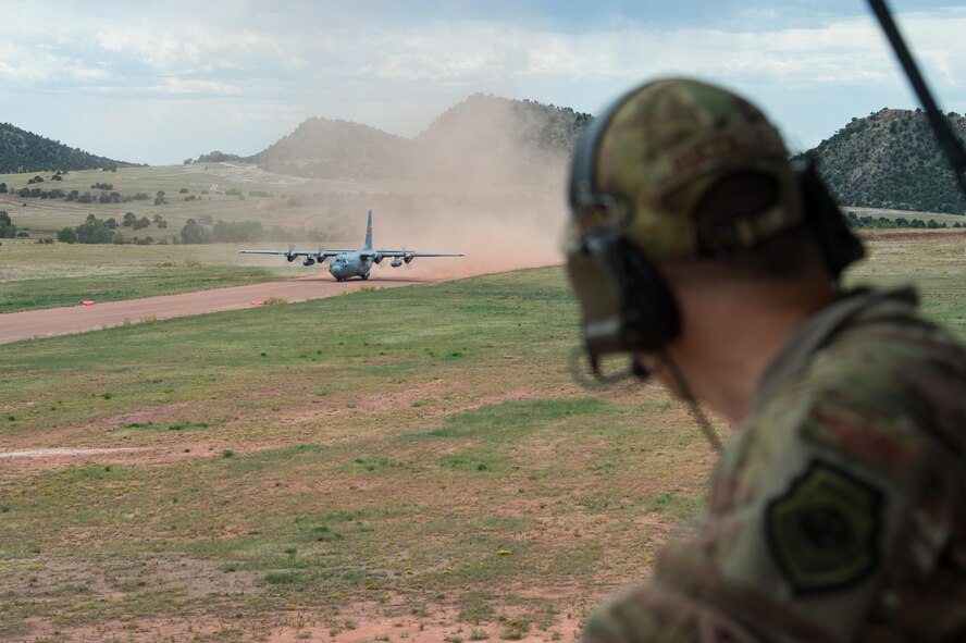 Maj. John Fuccillo, an air mobility liaison officer, looks on as a C-130 Hercules takes off during exercise Cerberus Strike 16-02 at the Red Devil Landing Zone, Colo., Sept. 12, 2016. Contingency response forces rehearsed potential real-world situations by training with Army counterparts during the exercise. Fuccillo is with the 621st Mobility Support Operations Squadron assigned to the Army's 4th Infantry Division at Fort Carson, Colo. (U.S. Air Force photo/Master Sgt. Joseph Swafford)