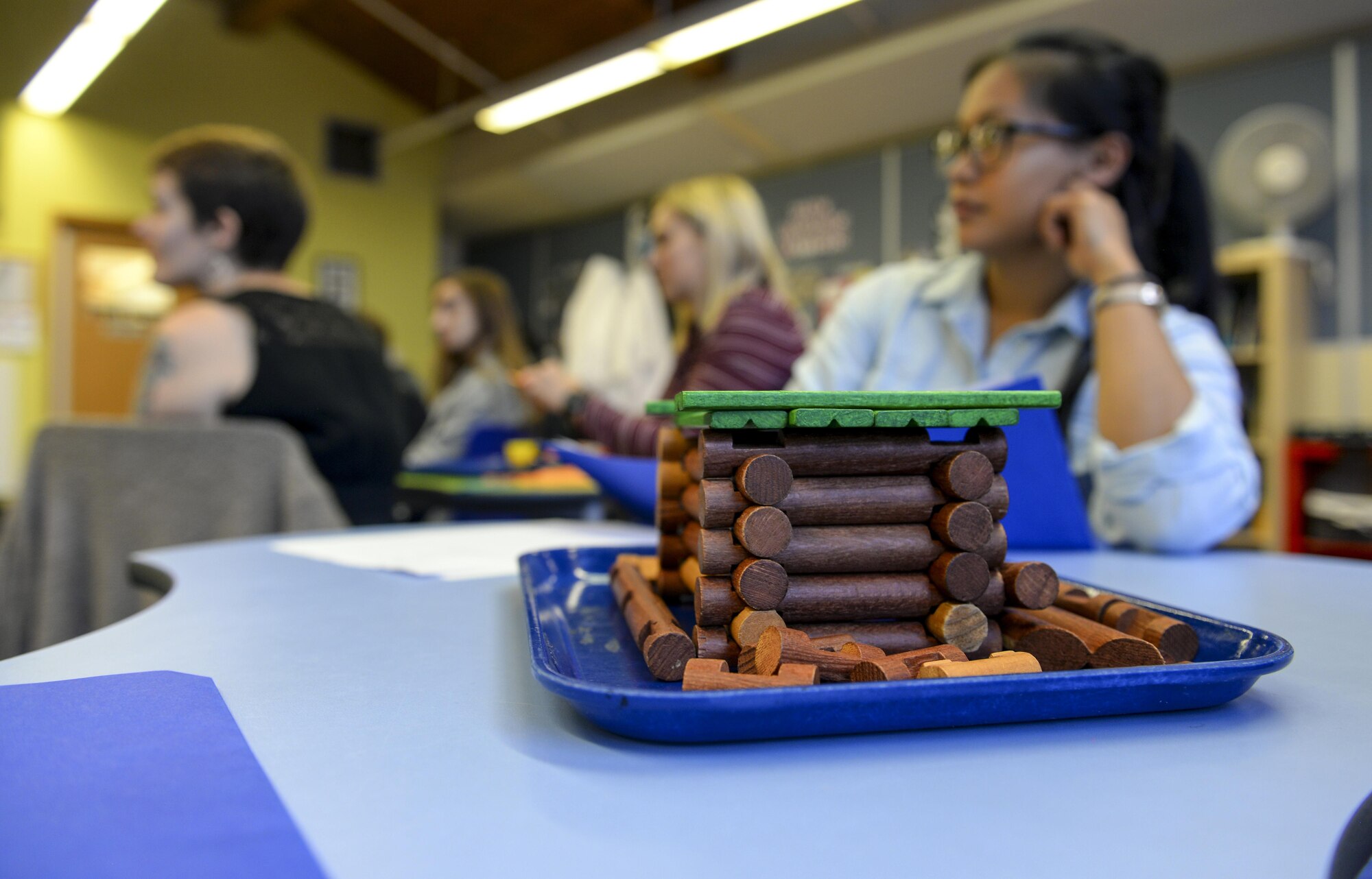 Participants in the 2016 Child and Youth Programs Training Conference for the U.K. listen to their instructor during a Science, Technology, Engineering and Mathematics class Sept. 10, 2016, on RAF Mildenhall, England. During the class, participants used materials based off of the ‘Three Little Pigs’ to build small structures and learn the key components to teaching a S.T.E.M activity. Once built, the models were placed in front of a fan to test its structural integrity. (U.S. Air Force photo by Staff Sgt. Micaiah Anthony)