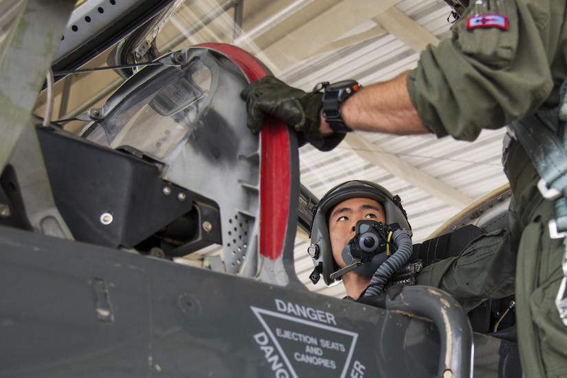 Air Force 2nd Lt. Chris Hsu, an Air Education and Training Command Judge Advocate legal intern, gets strapped in to a T-38 Talon before an incentive flight at Joint Base San Antonio-Randolph, Texas, July 27, 2016. Hsu was nominated by Air Force Col. Polly S. Kenny, AETC staff judge advocate, for the incentive flight due to his exemplary performance while working as an intern. Air Force photo by Airman 1st Class Lauren Ely