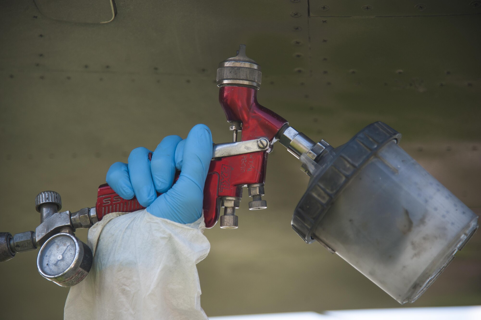 A low observable technician from the 509th Maintenance Squadron sprays a coating of paint on an FB-111A General Dynamics Aardvark static display at Whiteman Air Force Base, Mo., Sept. 13, 2016. After previously being painted solid gray, the aircraft will now have a “dark vark” scheme of dark green and gray. (U.S. Air Force photo by Senior Airman Joel Pfiester)
