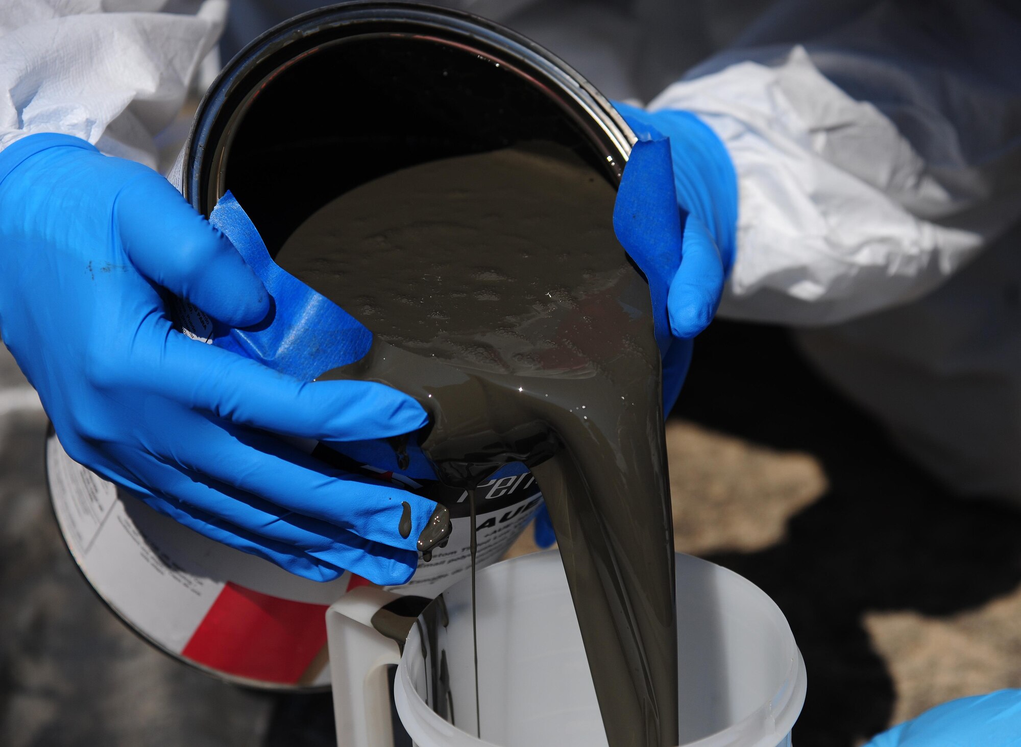 A batch of paint is mixed at Whiteman Air Force Base, Mo., Sept. 13, 2016. Two different colored paints were used to restore an FB-111A General Dynamics Aardvark static display on base. After previously being painted solid gray, the aircraft will now have a “dark vark” scheme of dark green and gray. (U.S. Air Force photo by Senior Airman Joel Pfiester)