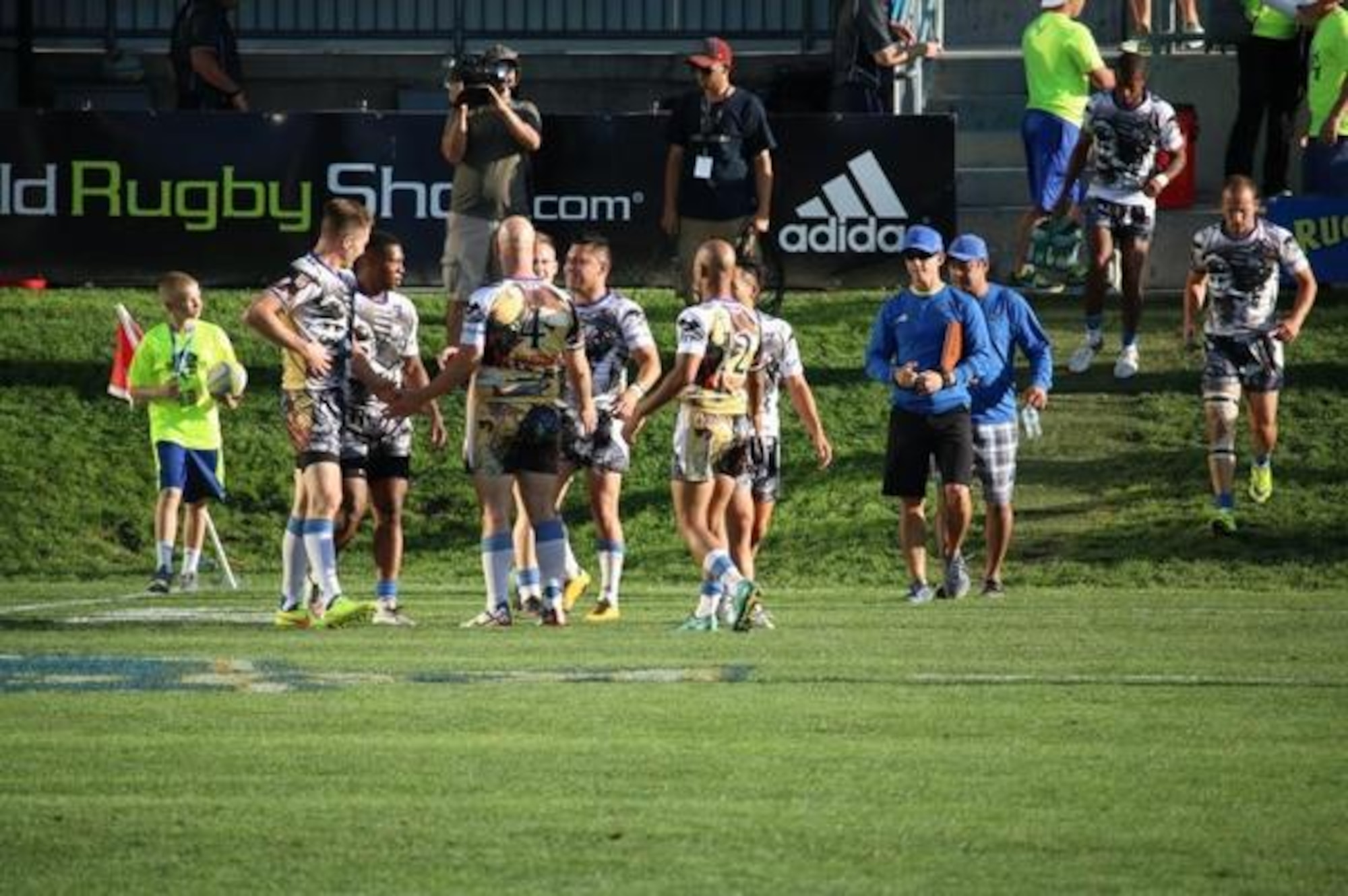 Air Force rugby head coach Lt. Col. John McQuade (second right), walks onto the field after his team defeated Navy during the Armed Forces Rugby Championships Aug. 26, 2016, at Infinity Park in Glendale, Colo. (Courtesy photo)