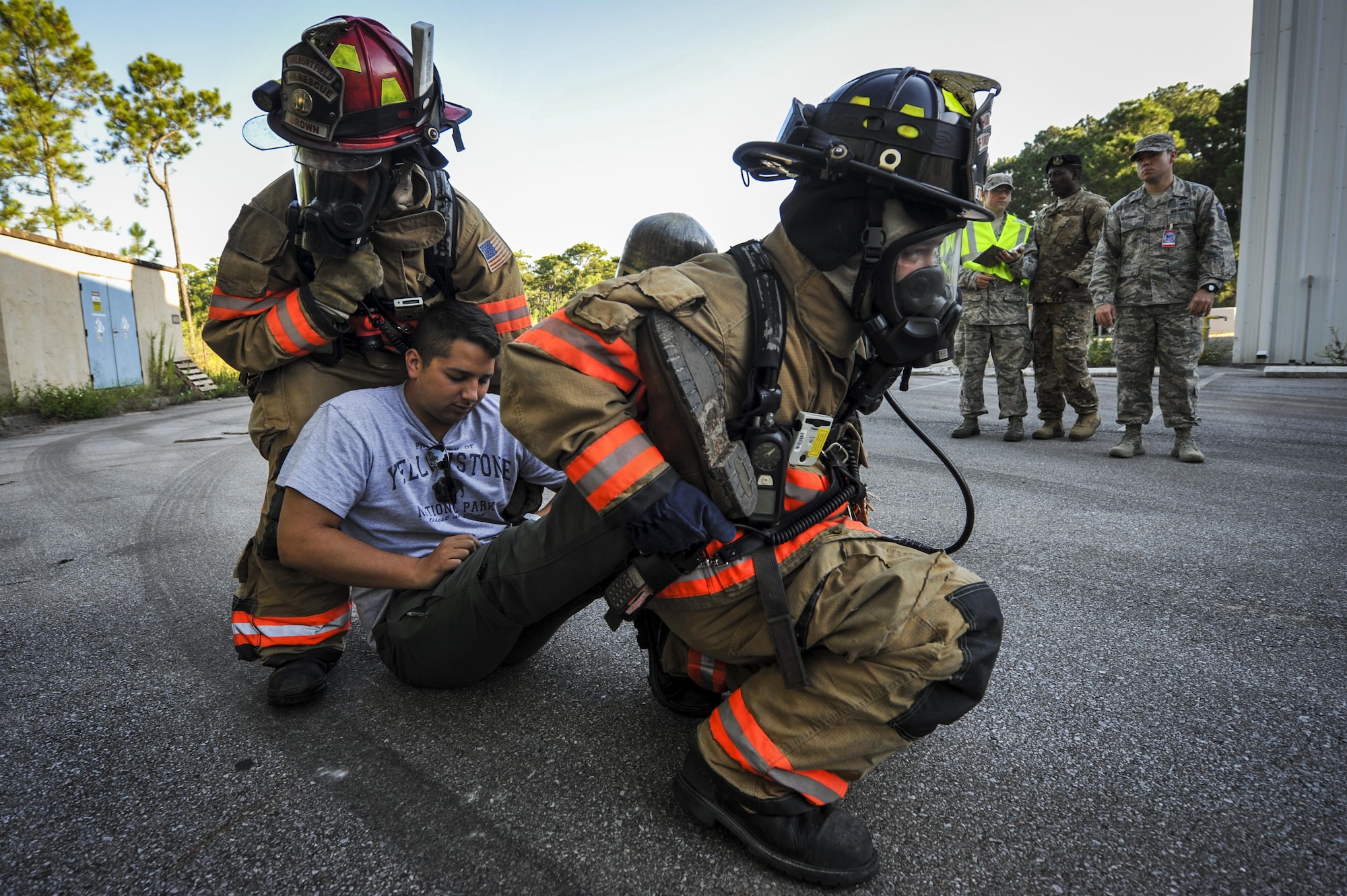 Senior Airman Joshua Brown and Airman 1st Class Derrick Stanley, firefighters with the 1st Special Operations Civil Engineering Squadron, carry a simulated victim during an exercise at Hurlburt Field, Fla., Sept. 15, 2016. The 1st Special Operations Wing conducted a three-day exercise to ensure personnel are up to date on emergency response procedures. (U.S Air Force photo by Airman 1st Class Joseph Pick)