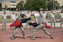 5th WOT Trainees demonstrating rifle fighting techniques during pugil stick training.