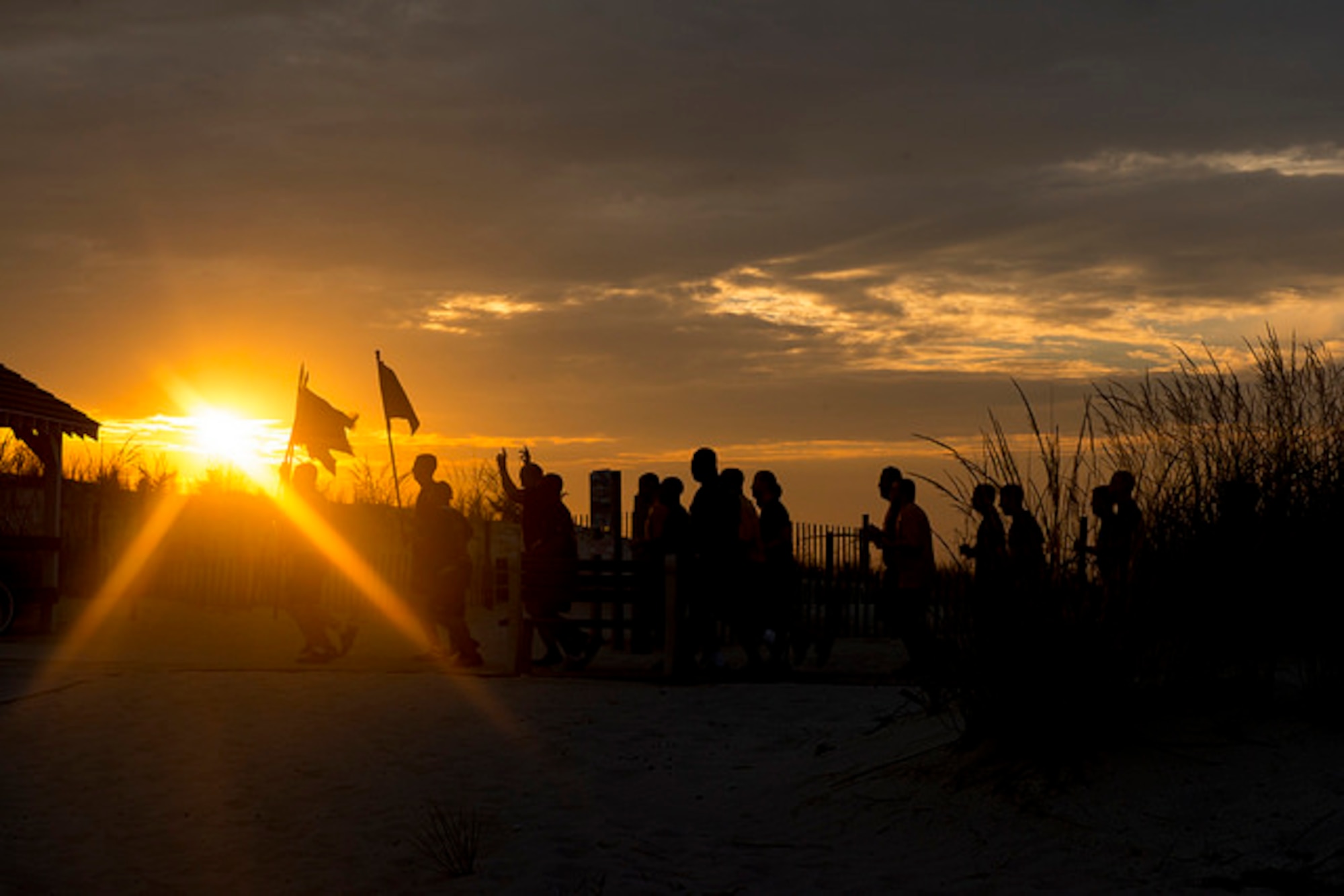 A group of nearly 30 Nave Cheif Petty Officers run along the boardwalk at sunrise in Seaside Park, N.J. Sept. 9. The Chiefs ran 9.11 miles in remembrance of September 11, 2001.