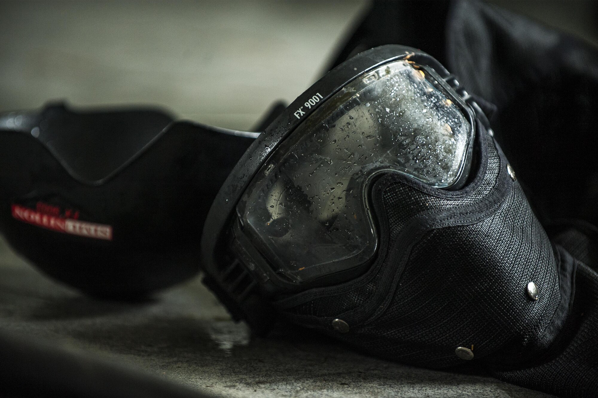 A protective mask rests on a table during combat survival training, Sept. 13, 2016, at Moody Air Force Base, Ga.  As a part of the training, aircrew members fended off teams of opposing forces to test their survival, evasion, resistance and escape skills in an isolated environment. (U.S. Air Force photo by Airman 1st Class Daniel Snider)