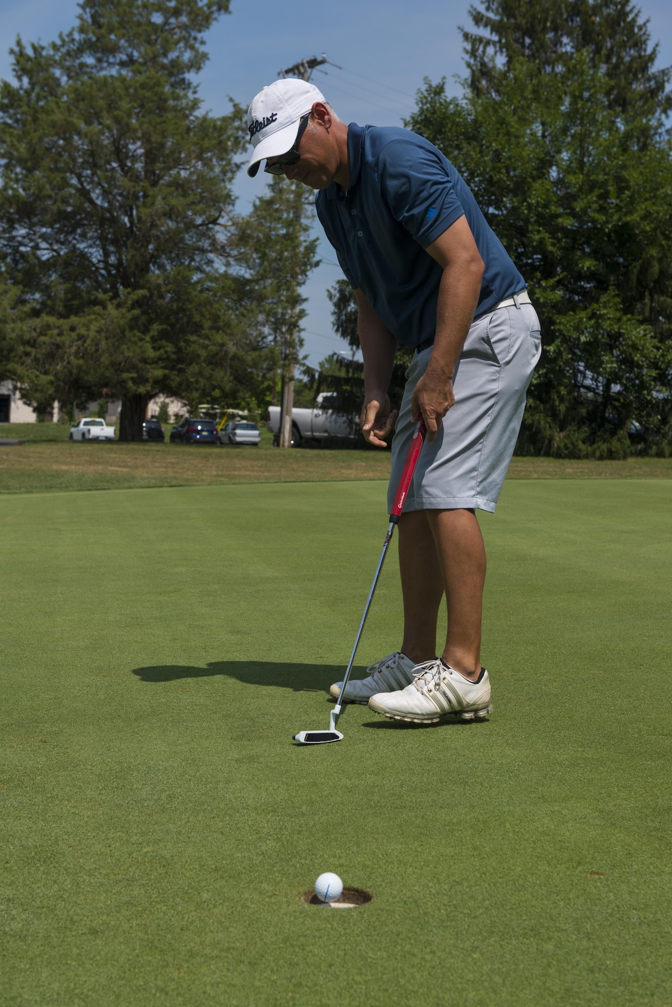 Senior Master Sgt. Jason Perry, Precision Measurement Equipment Laboratory superintendent, sinks a putt during a round of golf of Joint Base McGuire-Dix-Lakehurst, N.J. Perry made the Air Force golf team for the seventh time this year.
