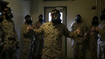 Cpl. Austin Potts, Chemical, Biological, Radioactive and Nuclear defense specialist, Headquarters and Service Battalion, Marine Corps Security Force Regiment, asks Marines to give a “thumbs-up” signal to signify they are ready for exposure to the compound 2-chlorobenzalmalonitrile, or CS gas, aboard Naval Station Norfolk, Va., Sept. 15, 2016. The Marines spent two days learning about CBRN defenses and concluded their training in the gas chamber as part of their annual qualification. 