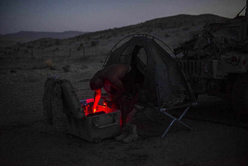 Capt. Aaron Gunning, a civil affairs Soldier from Augusta, Ga., from the 437th Civil Affairs Battalion, gets ready for the evening at National Training Center Fort Irwin, Calif., Sept. 5, 2016. The 437th Civil Affairs Bn. keeps troops trained and proficient in order to support the s 352nd Civil Affairs Command’s mission to support the Central Command area of operations. (U.S. Army photo by Master Sgt. Mark Burrell, 352nd CACOM)