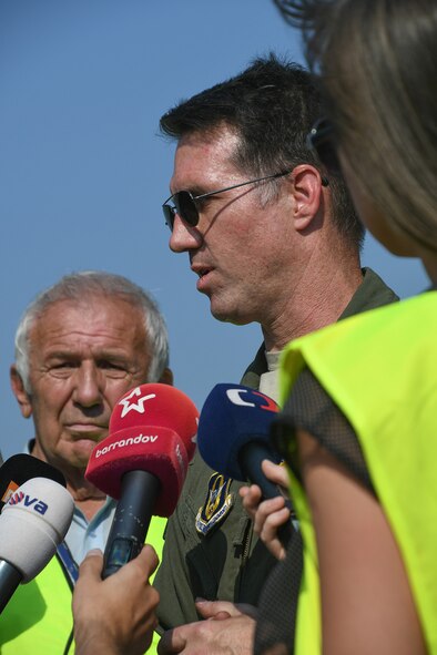 U.S. Air Force Lt. Col. Brian McClanahan,  345th Bomb Squadron commander, answers questions from the media at the Leos Janacek Airport, Ostrava in the Czech Republic on Sept. 13, 2016. McClanahan flew in on a B-1 Lancer from the 7th Bomb Wing to join a B-52 Stratofortress from the 307th Bomb Wing at the airport for the 2016 NATO Days Air Show being held Sept. 17-18. (U.S. Air Force photo by Master Sgt. Dachelle Melville/Released)