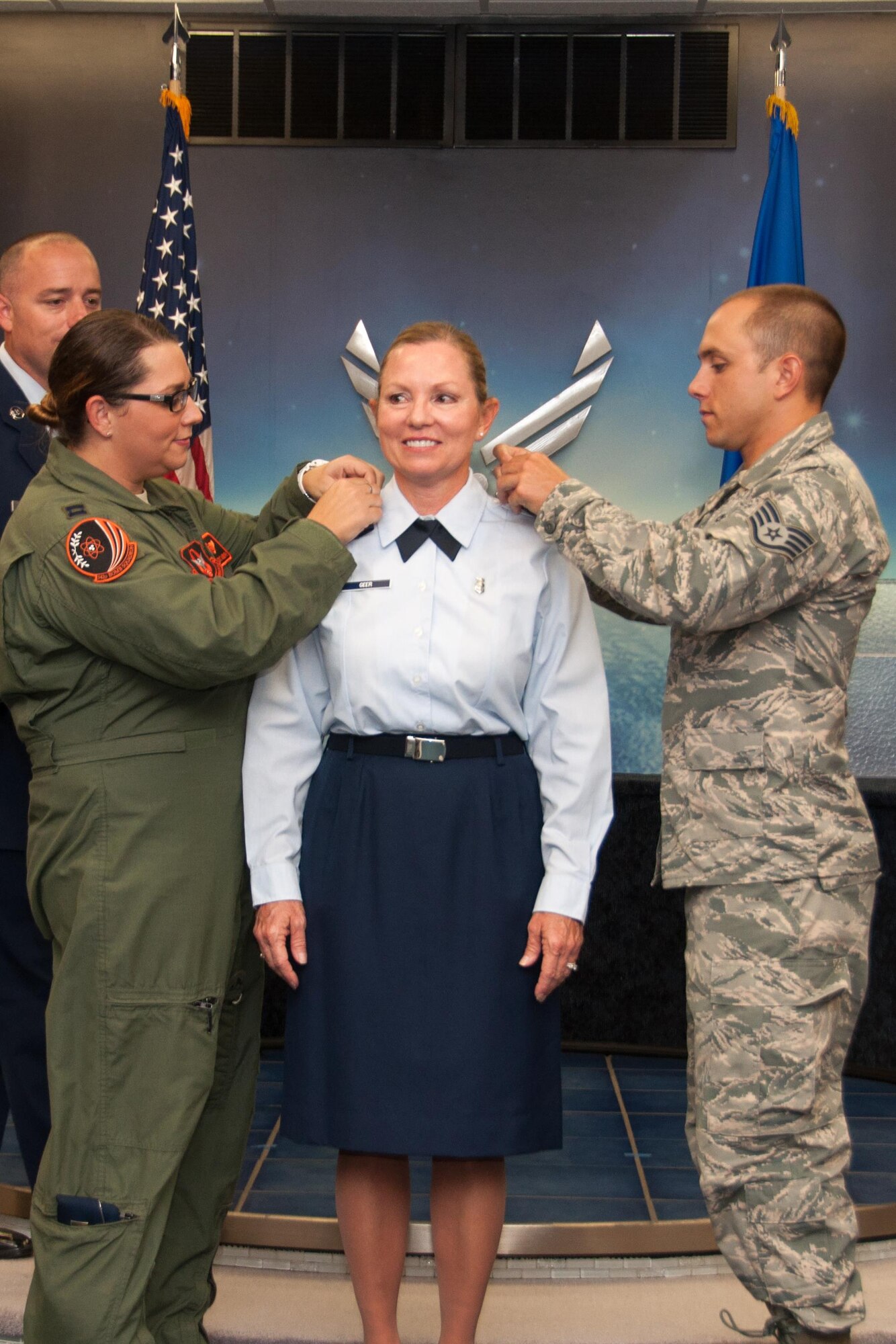 U.S. Air Force Col. Susan Geer, 307th Bomb Wing Medical Squadron gets pinned by Capt. Andrea Ross, 343rd Bomb Squadron and Staff Sgt. Josh Amburn, during her promotion ceremony, September 10, 2016, Barksdale Air Force Base, La.  Ross and Amburn are Geer’s daughter and son who have carried on the family’s tradition of military service into a third generation. (U.S. Air Force photo by Master Sgt. Laura Siebert/Released)