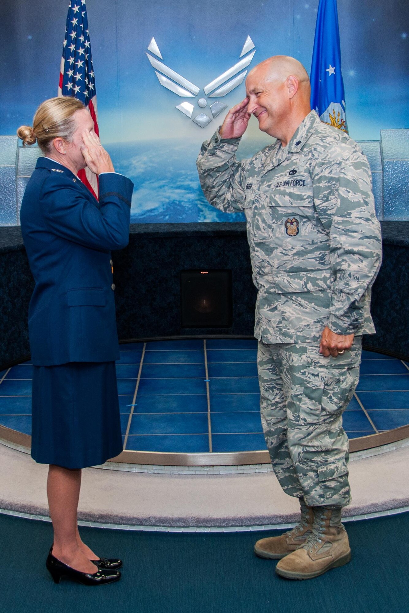 U.S. Air Force Lt. Col. Mark Geer, Inspector General for the 307th Bomb Wing, renders a first salute to his wife Col. Susan Geer, 307th Bomb Wing Medical Squadron, during her promotion ceremony, September 10, 2016, Barksdale Air Force Base, La. Geer’s father was in the military and her children are continuing the tradition for a third generation.  (U.S. Air Force photo by Master Sgt. Laura Siebert/Released)