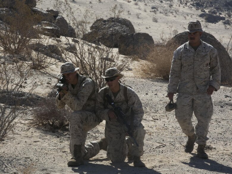 Sgt. Aaron Rivera, platoon sergeant, Company A, 3rd light Armored Reconnaissance Battalion, instructs his Marines on the warning signs of Improvised Explosive Devices while practicing patrolling at Range 100 aboard Marine Corps Air Ground Combat Center, Twentynine Palms, Calif., Sept. 8, 2016. The training prepared the company to be the opposing force for 3rd LAR, Company C. (Official Marine Corps photo by Cpl. Thomas Mudd/Released)