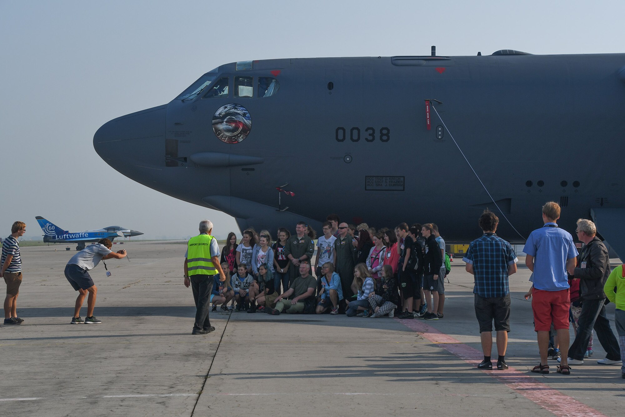 U.S. Air Force Maj. Kyle Holt, assigned to the reserve 93rd Bomb Squadron, Barksdale Air Force Base, La., and Capt. Brent Kerns, assigned to the active duty 11th Bomb Squadron, also at Barksdale, poses for a picture with an elementary school class at the nose of a B-52 Stratofortress, from the 307th Bomb Wing, Barksdale AFB, parked at the Leos Janacek Airport, Ostrava in the Czech Republic on Sept. 14, 2016. Three classes from a local elementary school received a special tour of the B-52 and a B-1 Lancer from the 7th Bomb Wing, Dyess AFB, Texas. Both bombers flew into Ostrava for the 2016 NATO Days Air Show after participating in Exercise Ample Strike 16, a Czech Republic led multi-nation live exercise. (U.S. Air Force photo by Master Sgt. Dachelle Melville/Released)