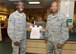 Plastic bags are now available at the Joshua Tree Inn Dining Facility thanks to Airman 1st Class Gabriel Osirus III (left), 412th Medical Group Mental Health technician, who proposed the idea to Chief Master Sgt. Todd Simmons, 412th Test Wing command chief (right). (U.S. Air Force photo by Kenji Thuloweit)