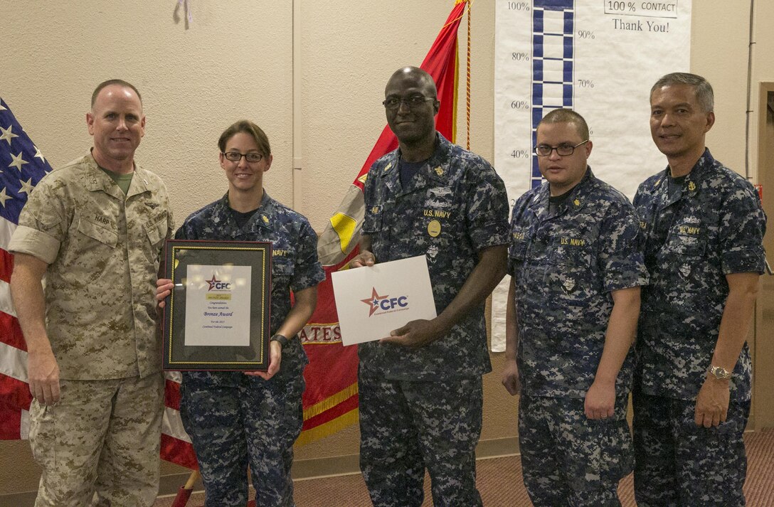 Col. James Harp, Combat Center Chief of Staff, presents the Bronze Award to Robert E. Bush Naval Hospital Twentynine Palms during the Combined Federal Campaign Kick-off luncheon at the Frontline Restaurant, Sept. 9, 2016. The CFC gives the Bronze Award when a unit has had 50 to 60 percent participation or $50 to $65 per capita giving. (Official Marine Corps photo by Lance Cpl. Dave Flores/Released)