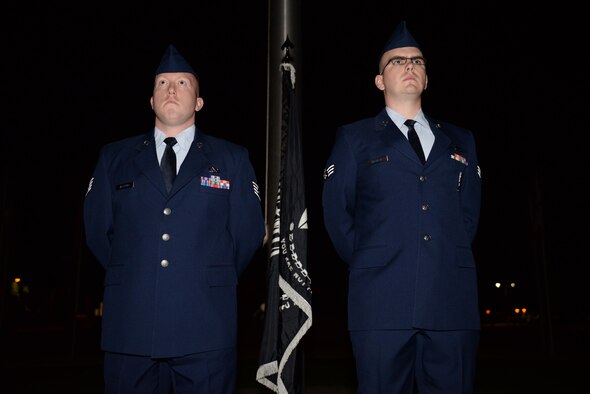 Staff Sgt. Michael Alstrin, 56th Equipment Maintenance Squadron maintainer, and Senior Airman Connor Macklin, 308th Aircraft Maintenance Squadron maintainer, stand watch during the loneliest hour at midnight Sept. 16, 2016, at Luke Air Force Base. The watch was conducted in honor of the National POW/MIA Recognition Day honoring our missing service members and prisoners of war. (U.S. Air Force photo by Airman 1st Class Ridge Shan)
