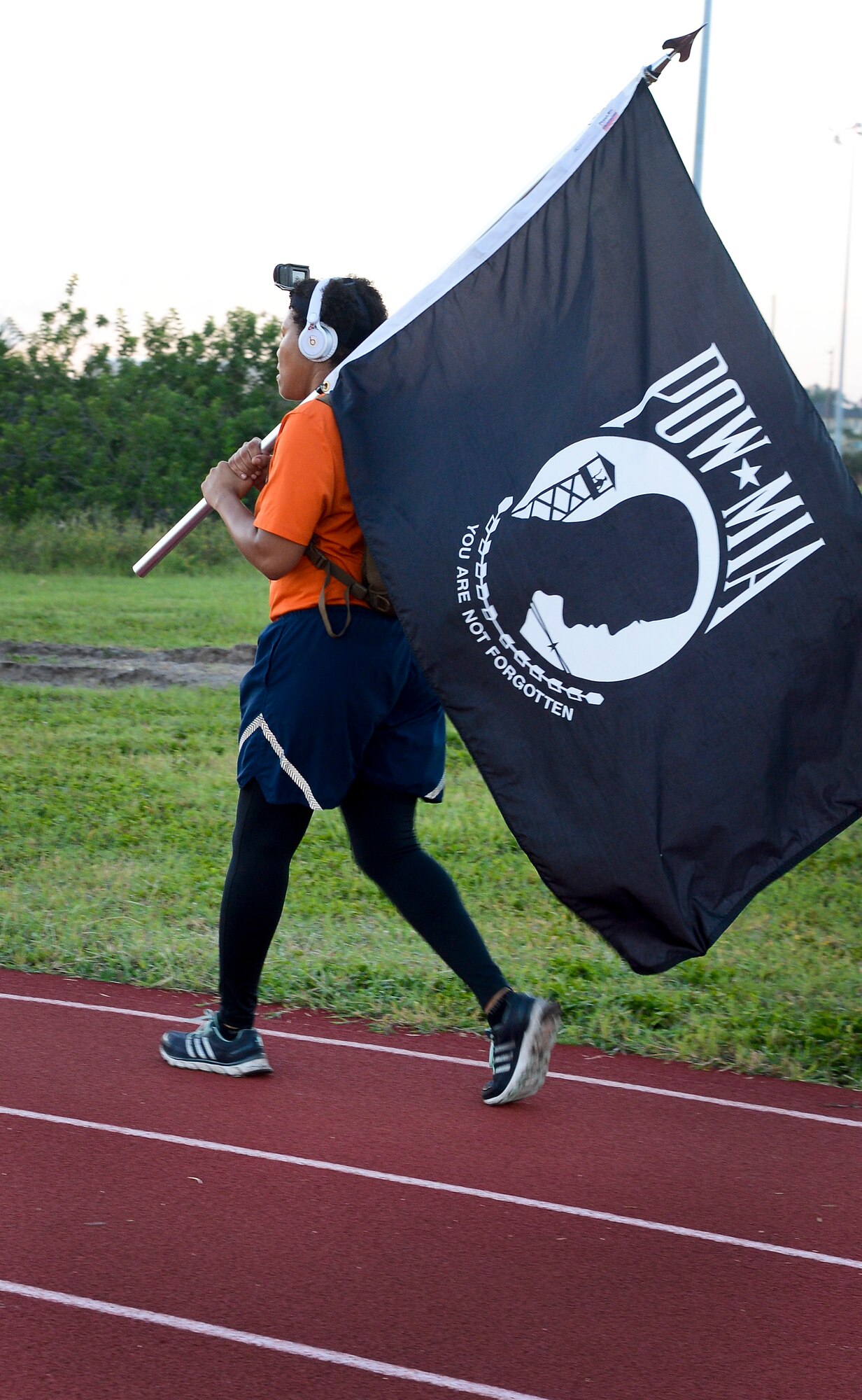 An Airman assigned to the 6th Communications Squadron walks during the POW/MIA Run/Walk, Sept. 16, 2016 at MacDill Air Force Base, Fla. This event is one way Team MacDill recognizes and pays homage to the brave sacrifices made by service members. (U.S. Air Force photo by Senior Airman Jenay Randolph) 