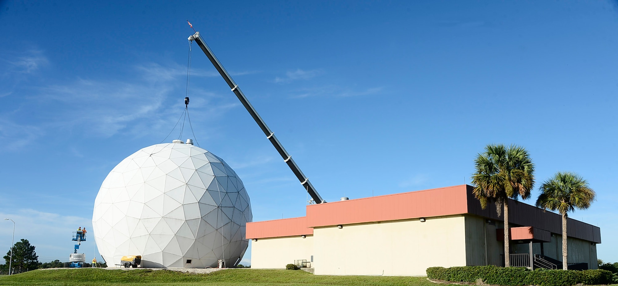 The radome and satellite at building 1750, otherwise known as the "golf ball" undergoes permanent deconstruction Sept. 12, 2016, at MacDill Air Force Base, Fla. The radome has been a landmark on MacDill since the 1990s. (U.S. Air Force photo by Senior Airman Tori Schultz)