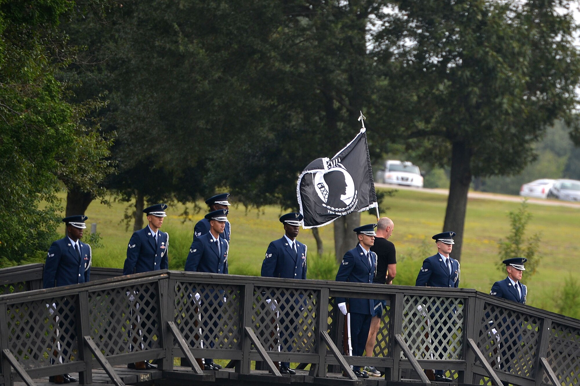 A Team Shaw member runs with a POW/MIA flag during a 24-hour National POW/MIA Recognition Day vigil run at Shaw Air Force Base, S.C., Sept. 16, 2016. The run was held to pay respect to American POW/MIA service members both past and present. (U.S. Air Force photo by Airman 1st Class Christopher Maldonado)