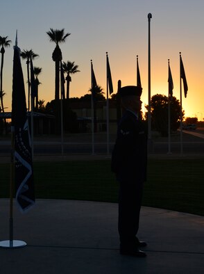 Airman 1st Class Matthew Frech, 56th Component Maintenance Squadron aircraft hydraulic apprentice, stands watch at sunrise during the National POW/MIA Recognition Day vigil Sept. 16, 2016, at Luke Air Force Base, Ariz. The vigil consisted of Airmen standing watch over a period of 24 hours honoring service members who are missing in action or are or were prisoners of war. (U.S. Air Force photo by Staff Sgt. Marcy Copeland)
