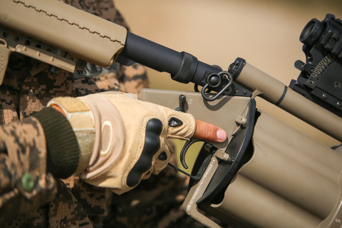 A Mongolian Armed Forces soldier keeps his finger straight and of the trigger during the non-lethal live-fire portion of the Non-Lethal Executive Seminar (NOLES) 2016 at Five Hills Training Area, Mongolia, Sept. 15, 2016. U.S. Marines with 3rd Law Enforcement Battalion instructed the Mongolian police and soldiers on the proper weapons handling procedures. NOLES is a regularly scheduled field training exercise and leadership seminar hosted annually by various nations throughout Asia Pacific. 