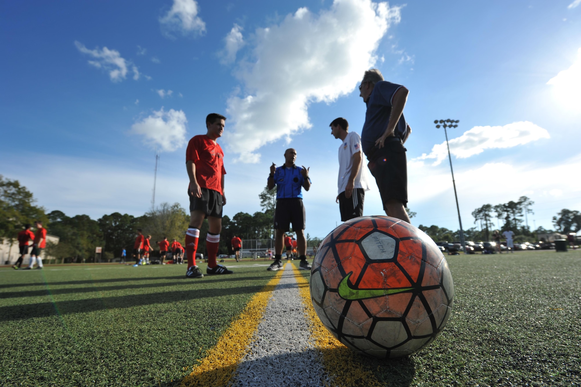 The 319th Special Operations Squadron and the 1st Special Operations Medical Group intramural soccer teams prepare to start the 2016 Intramural Soccer Championship game at Hurlburt Field, Fla., Sept. 13, 2016. The 1st SOMDG defeated the 319th SOS in a double elimination match with a final score of 2-0. (U.S. Air Force photo by Airman 1st Class Joseph Pick)
