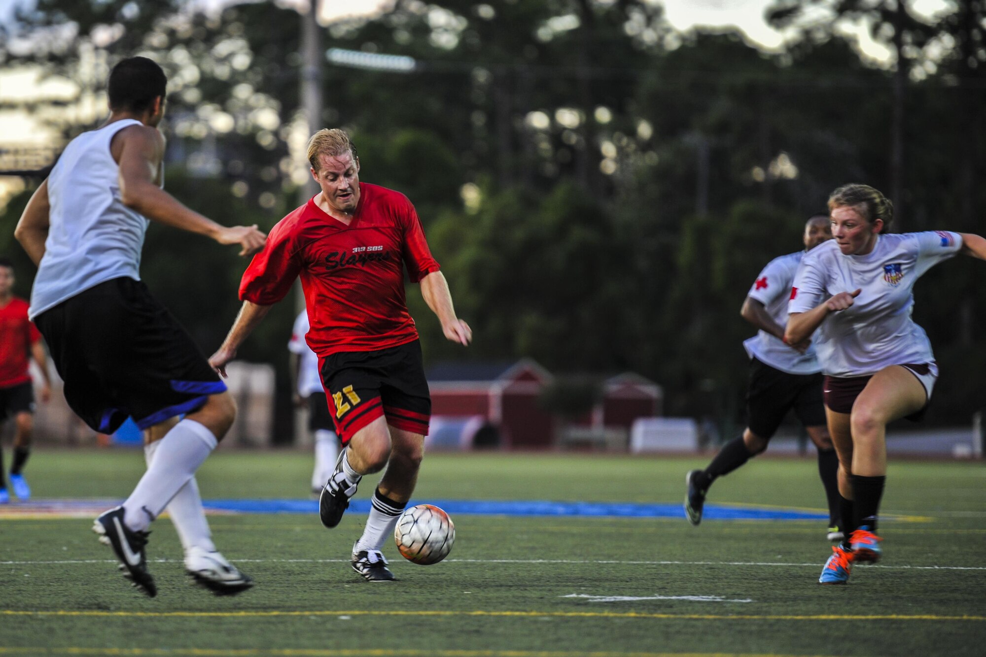 Brian Ersnt, a member of the 319th Special Operations Squadron’s intramural soccer team, dribbles a soccer ball up field during the 2016 Intramural Soccer Championship at Hurlburt Field, Fla., Sept. 13, 2016. The 319th SOS was undefeated all season until the 1st Special Operations Medical Group defeated them in a double elimination during the championship game. (U.S. Air Force photo by Airman 1st Class Joseph Pick)